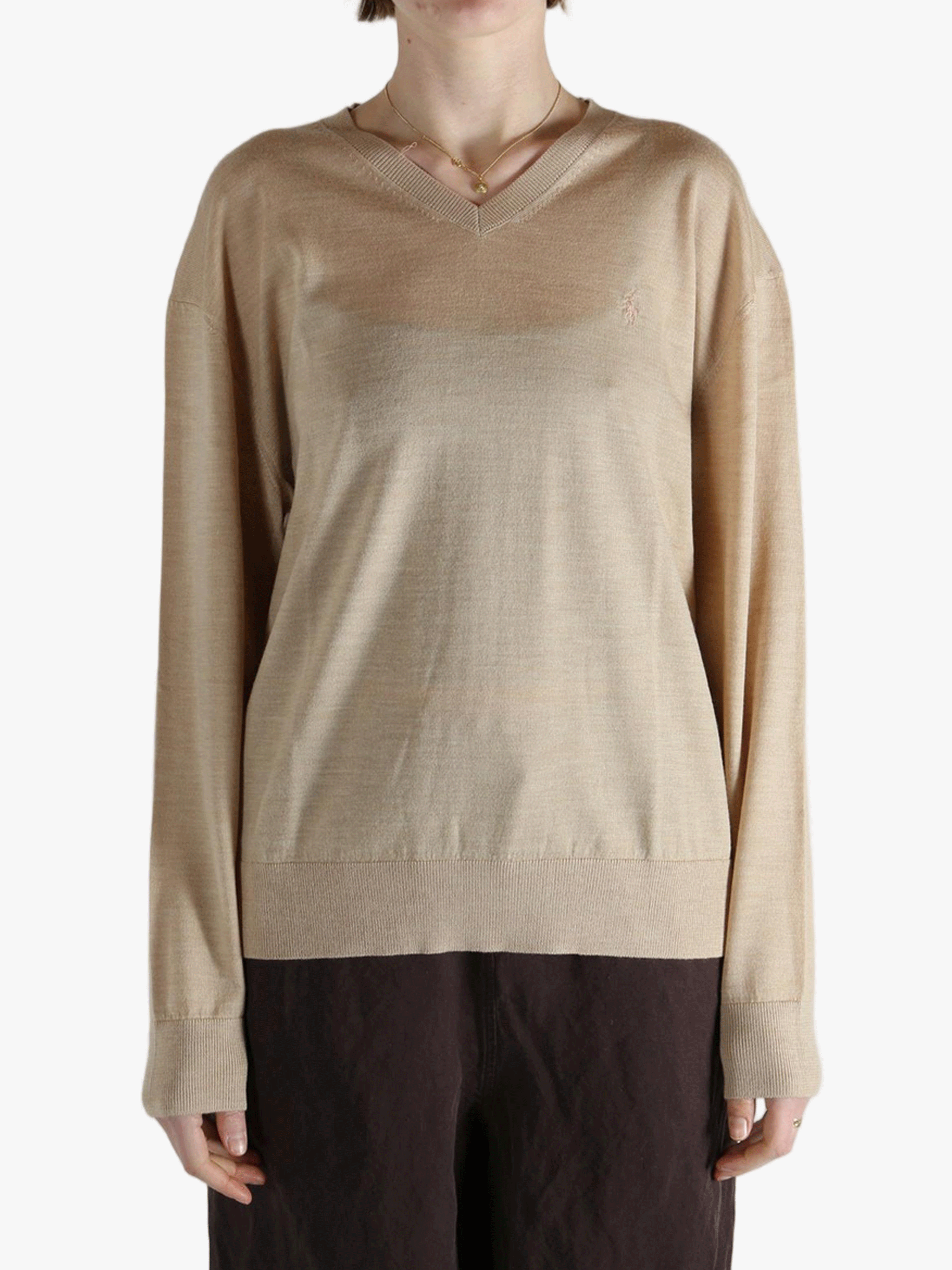 Tan sweater worn by a person, showing the sweater fit