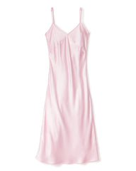 The Petite Plume Womens Silk Cosette Nightgown in Pink features a sleeveless, knee-length design with thin spaghetti straps and a V-neckline, offering a luxurious look reminiscent of silk sleepwear. The smooth, shiny fabric enhances its simple and elegant silhouette for any occasion.