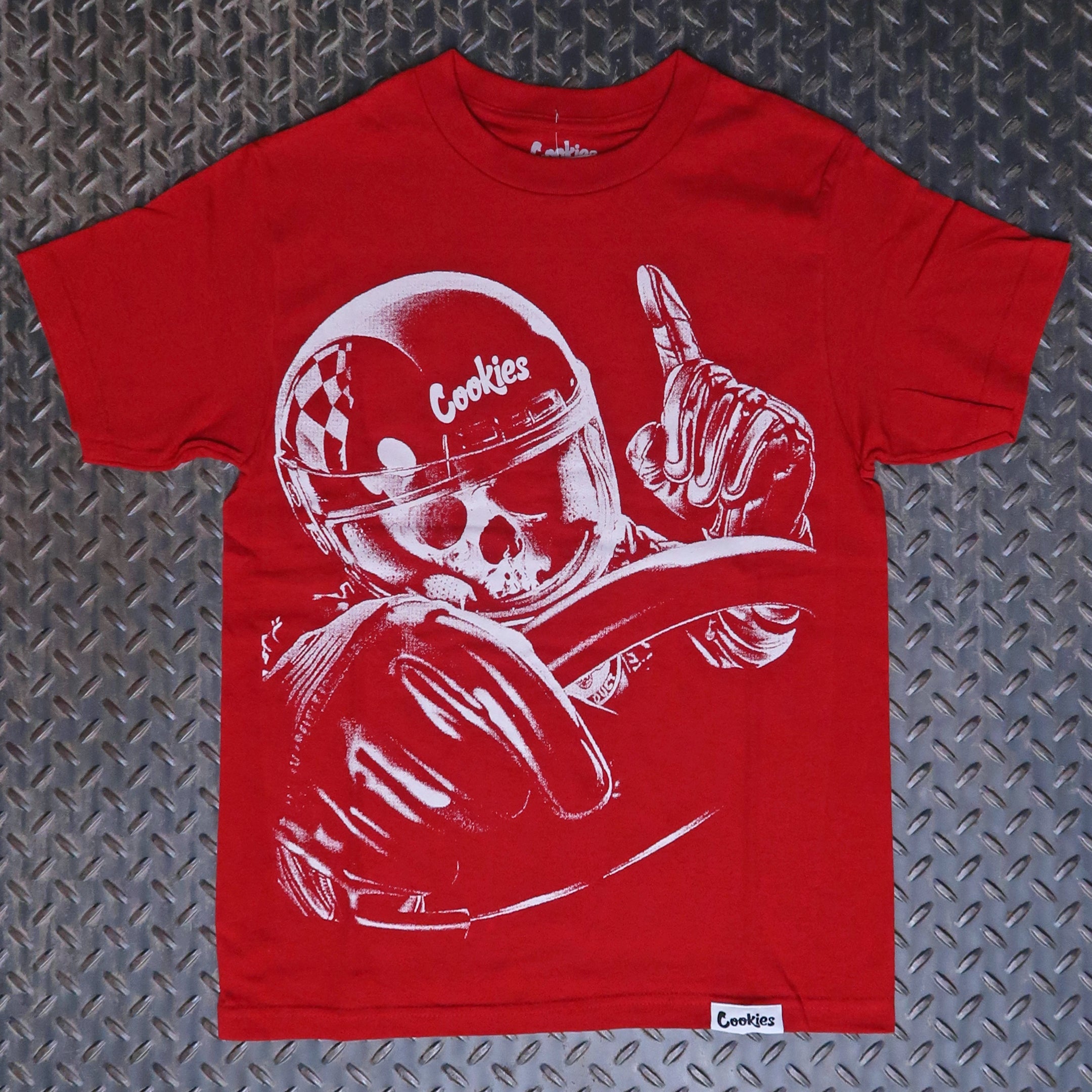 Red t-shirt with a graphic design of a skull wearing a helmet and holding a steering wheel