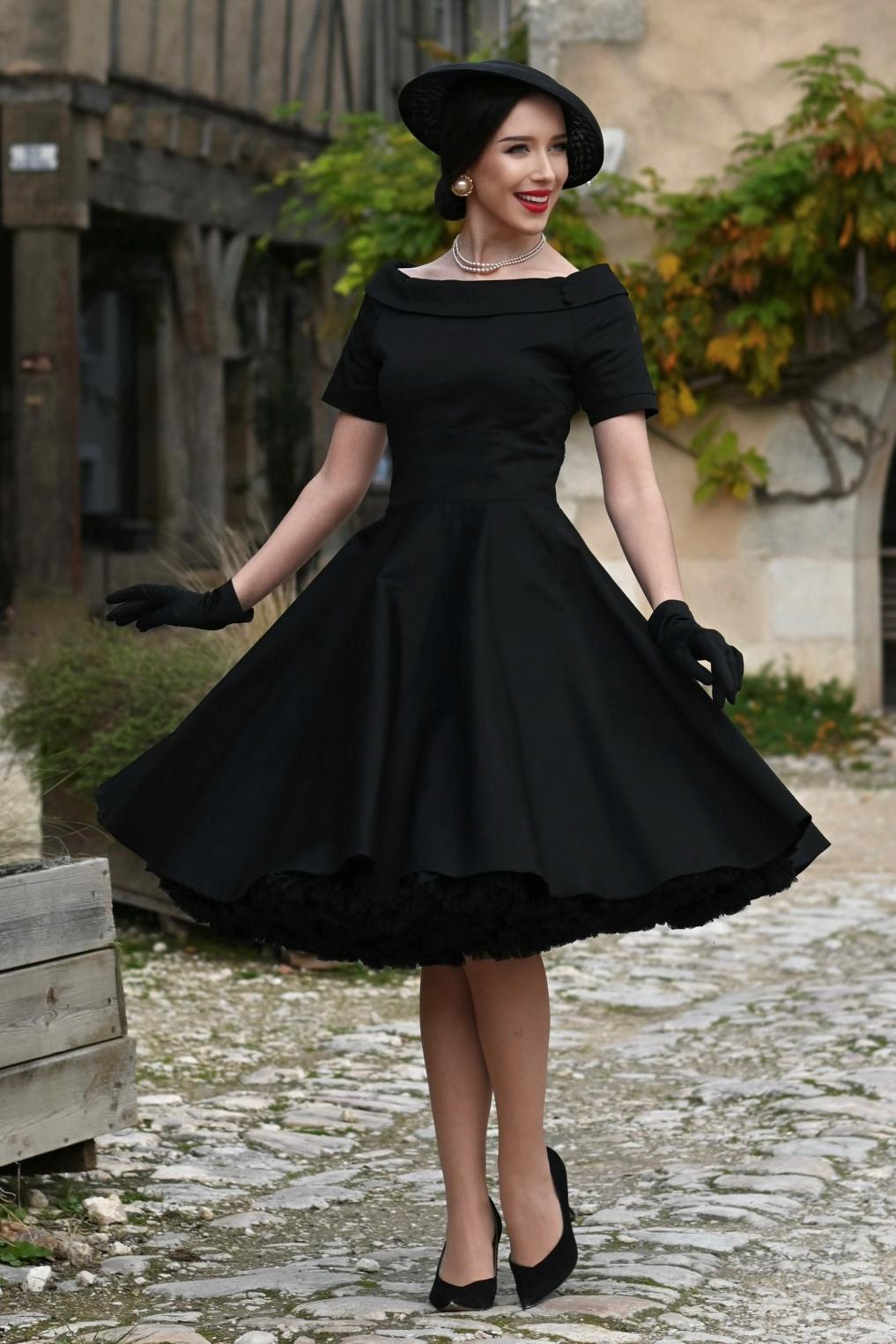 A charming model wearing a Darlene Little Black Dress