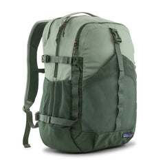Patagonia Refugio Daypack 30L in Cover Green — front view with mesh side pocket and daisy chain